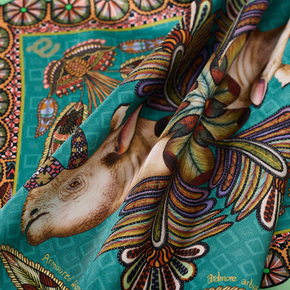 A detailed view of the silk fabric’s texture, showcasing the ornate patterns and warm earthy tones with fine craftsmanship.