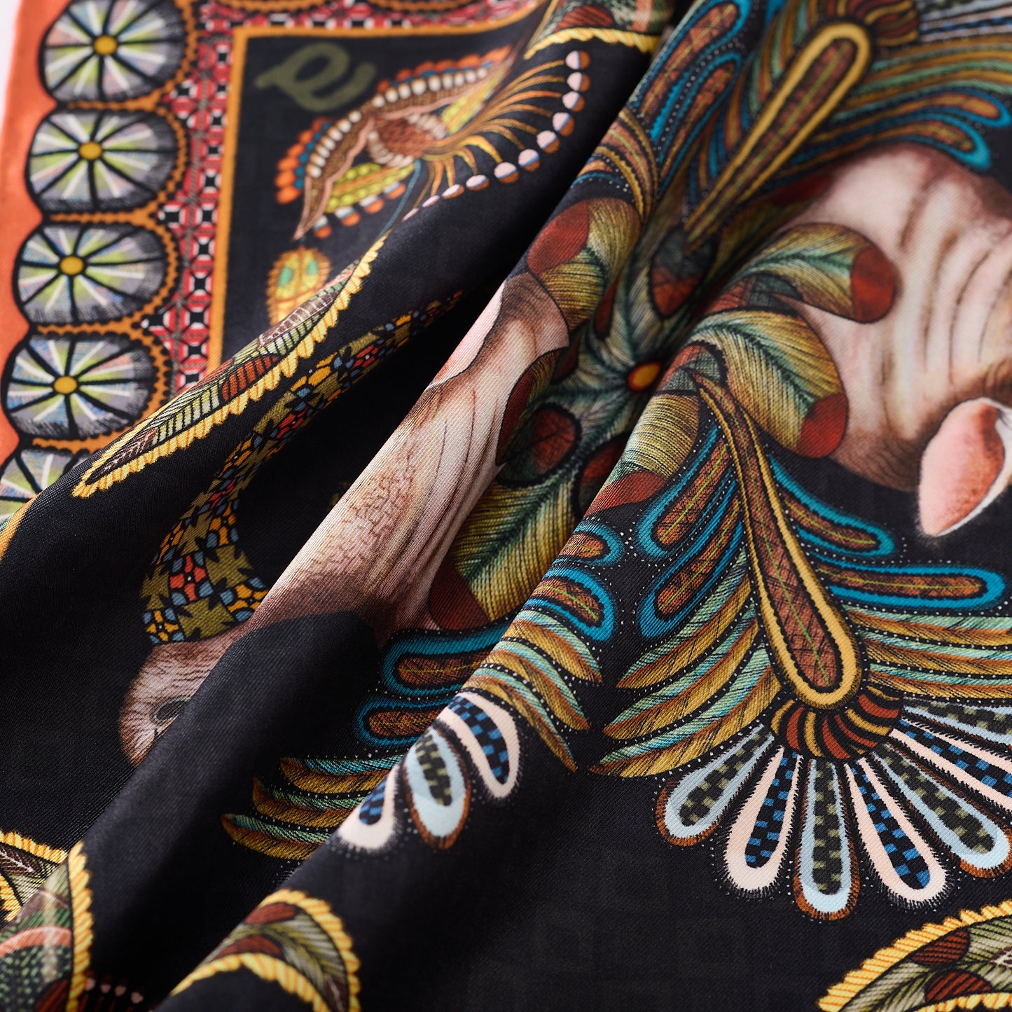 A close-up of the luxurious silk fabric draped elegantly, showcasing its soft texture and intricate detailing.