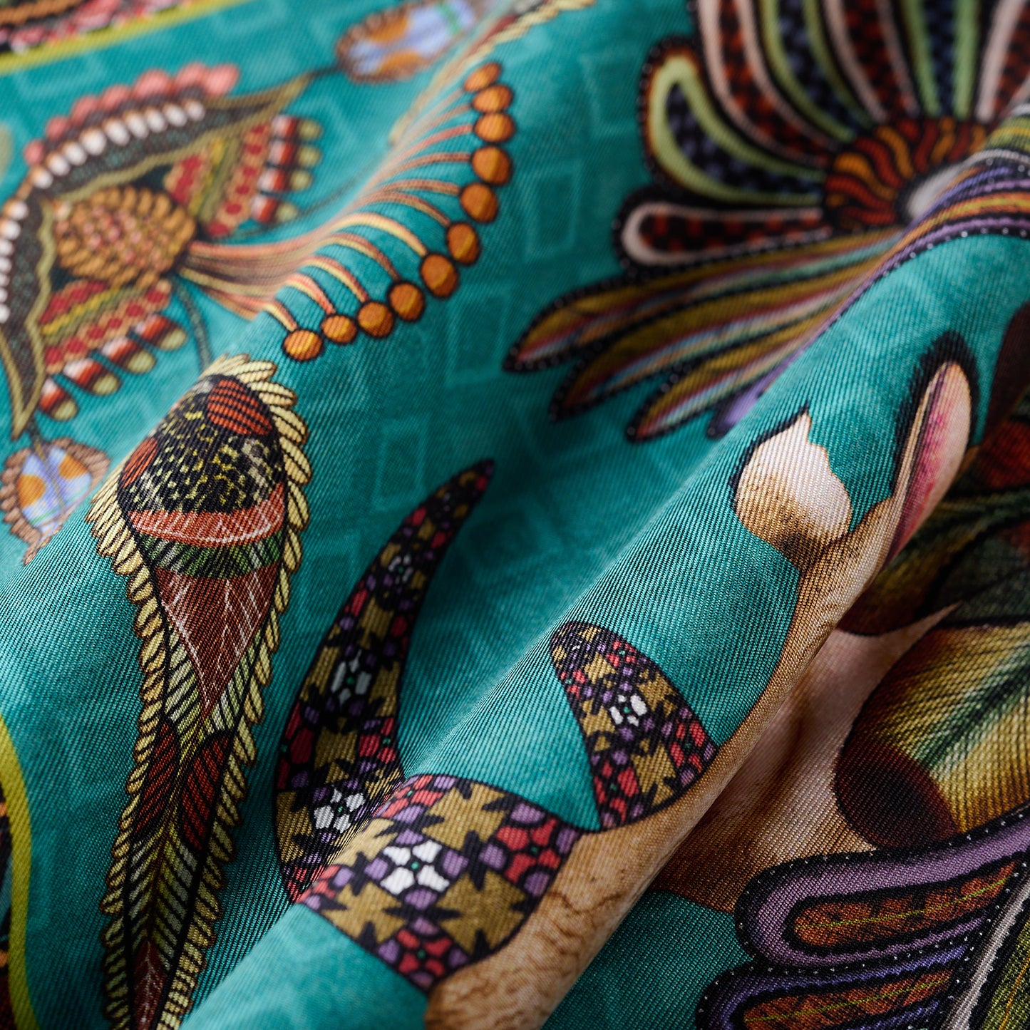 A close-up of one corner, highlighting the precise hand-rolled edges and vibrant design elements.