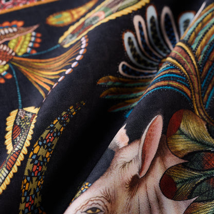 A focused view on one of the ornately decorated rhinos, showcasing the artistry in the silk print.