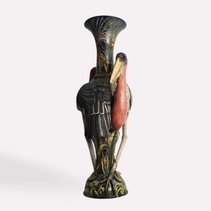 A side view of the vase, emphasizing the elongated shape and intricate feather detailing of the Marabou Storks. The sculpted birds appear to be standing protectively over the vessel, adding depth and realism.