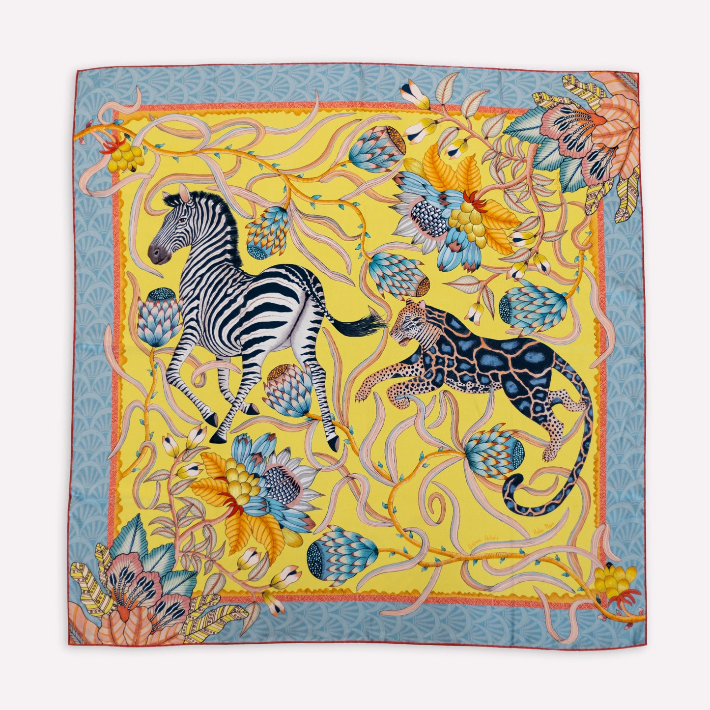 A zoomed-in section of the scarf displaying a majestic zebra and a sleek leopard intertwined with swirling floral and vine elements.