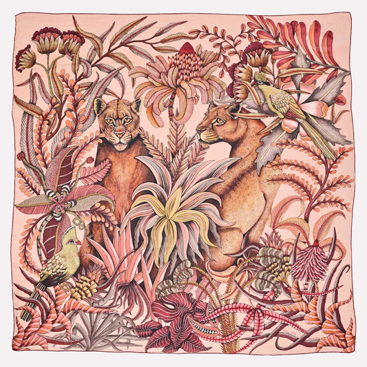 A square scarf featuring a rich, warm-toned African wildlife scene, with two lionesses amid intricate flamingo-coloured foliage, capturing the essence of the wild.