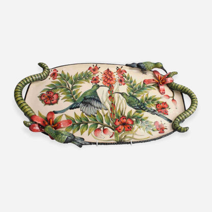 A ceramic tray with a hand-painted tropical scene featuring malachite sunbirds among lush green foliage and vibrant red flowers. The tray has sculpted handles designed to resemble intertwined vines.