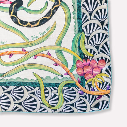 A zoomed-in segment of the intricate floral and vine motifs in deep green and pink tones.