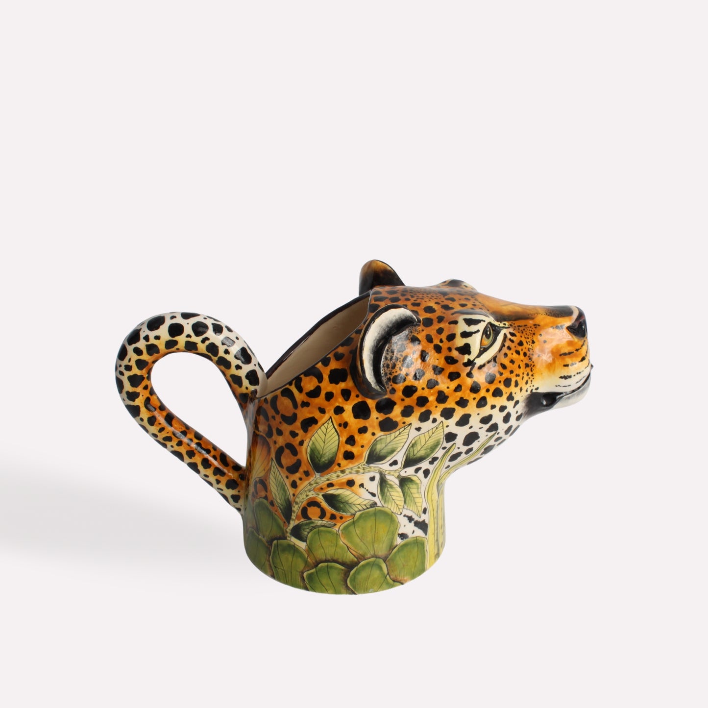 A side-angle perspective of the leopard head jug, showcasing its bold African-inspired patterns and lifelike facial features.