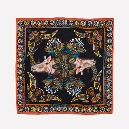 A square silk pocket square featuring two mirrored rhinos with intricate patterns, surrounded by floral and circular Zulu-inspired motifs on a black background.