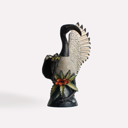 A back-angle view focusing on the layered feather detailing and the sculpture’s overall structure. The intricate hand-painted accents emphasise the beauty of the bird’s form and the artistry behind the piece.