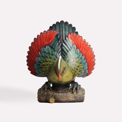  A back-facing perspective of the Turaco sculpture, highlighting the rich red and black tail feathers and the craftsmanship of the layered plumage.