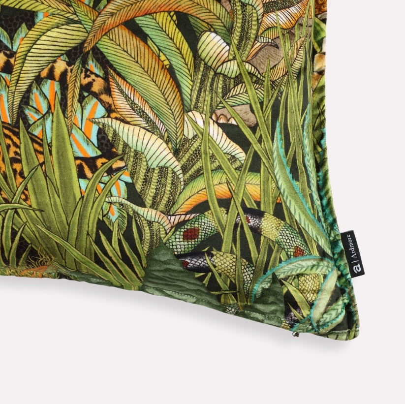 Angled view of the Sabie Forest Delta cushion cover, highlighting the intricate details of exotic plant patterns and the cushion's lush velvet texture.