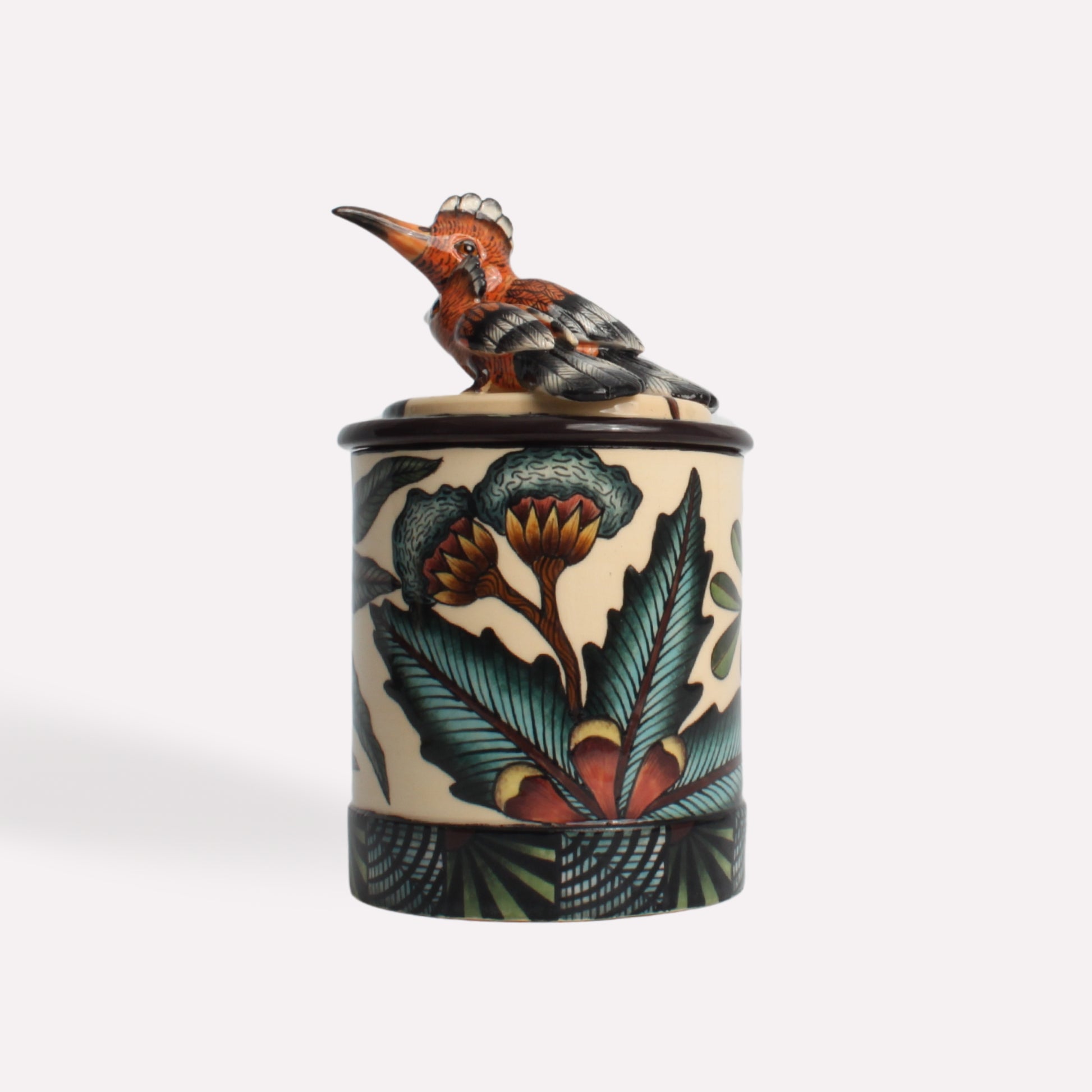 A side perspective of the candle container, emphasising the hoopoe bird's pose and the detailed artwork on the ceramic body.