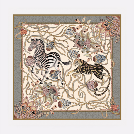 A luxurious silk scarf featuring an intricate safari-inspired print with zebras, leopards, and botanical elements in soft pearl tones, framed with a muted blue border.