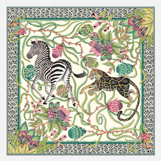 A luxurious wool and modal wrap featuring an intricate African-inspired design with zebras, vines, and protea flowers in soft green, pink, and ivory hues.