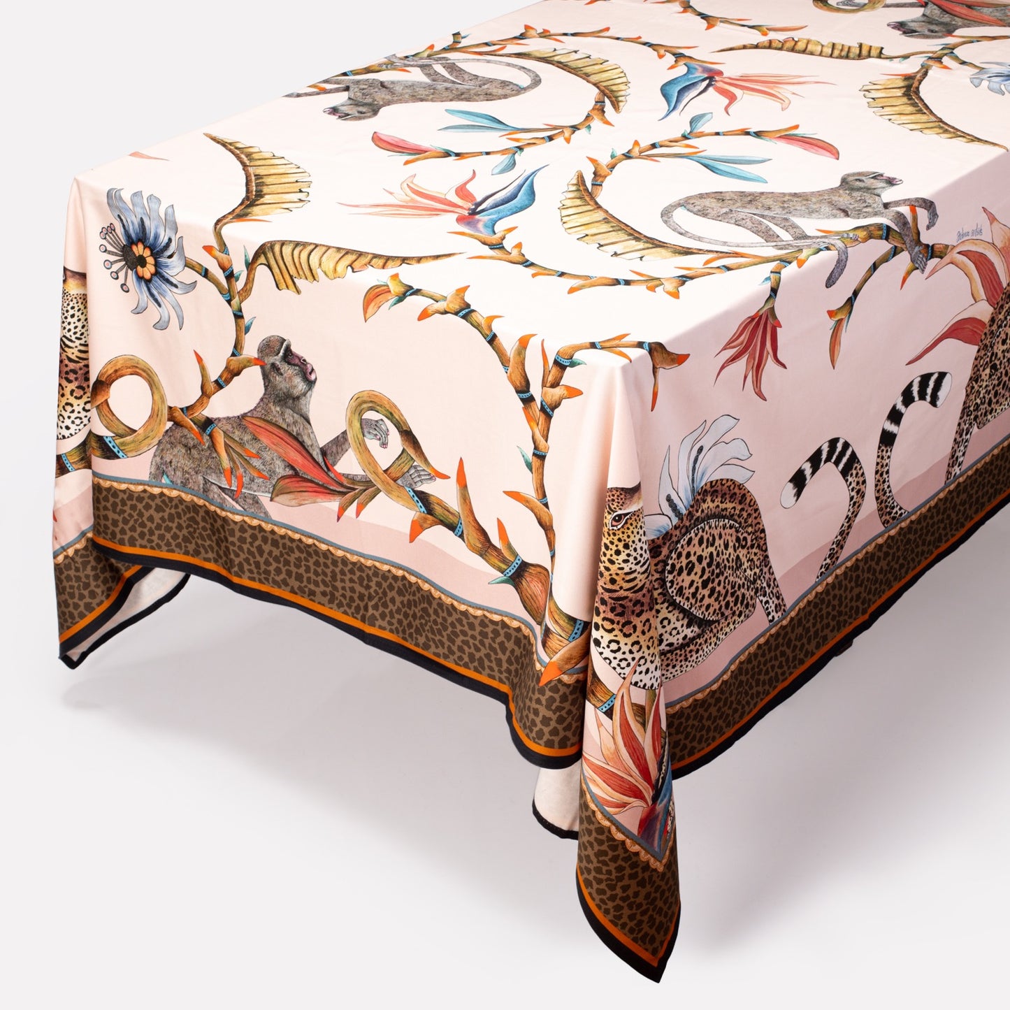 A large square Monkey Paradise Square Tablecloth with intricate wildlife and floral patterns, featuring leopards, birds of paradise, and lush greenery.